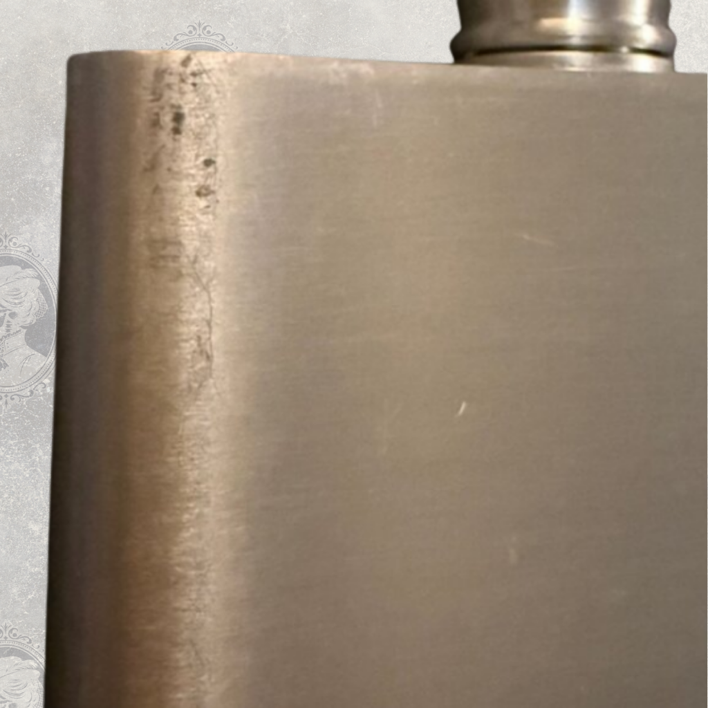 Side view of vintage Selwyn pewter hip flask showing light wear and brushed finish