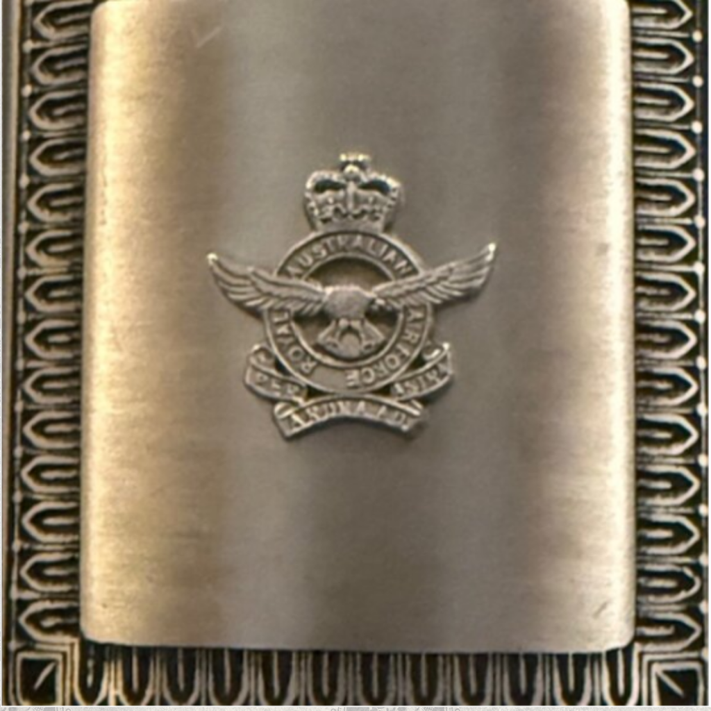 Close-up of Royal Australian Air Force RAAF crest on vintage Selwyn pewter hip flask