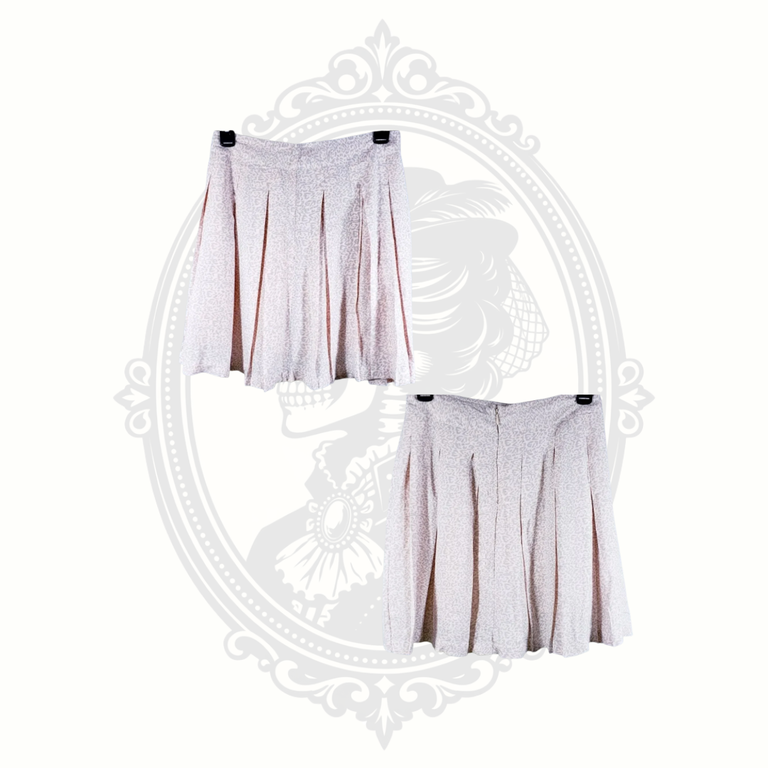 Sim and Sam pink leopard pleated skirt shown from front and back views