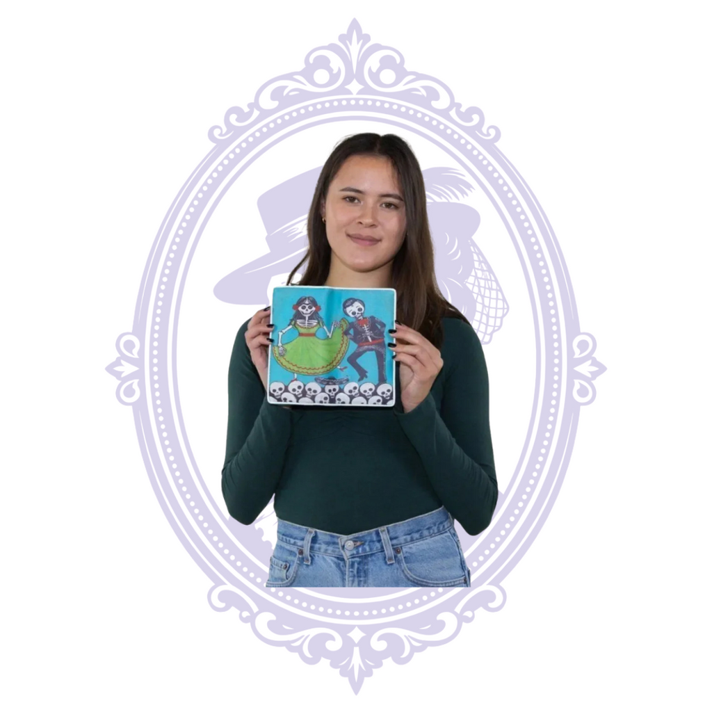 Model displaying the front of the turquoise vinyl wallet with dancing skeleton couple and skull pattern.