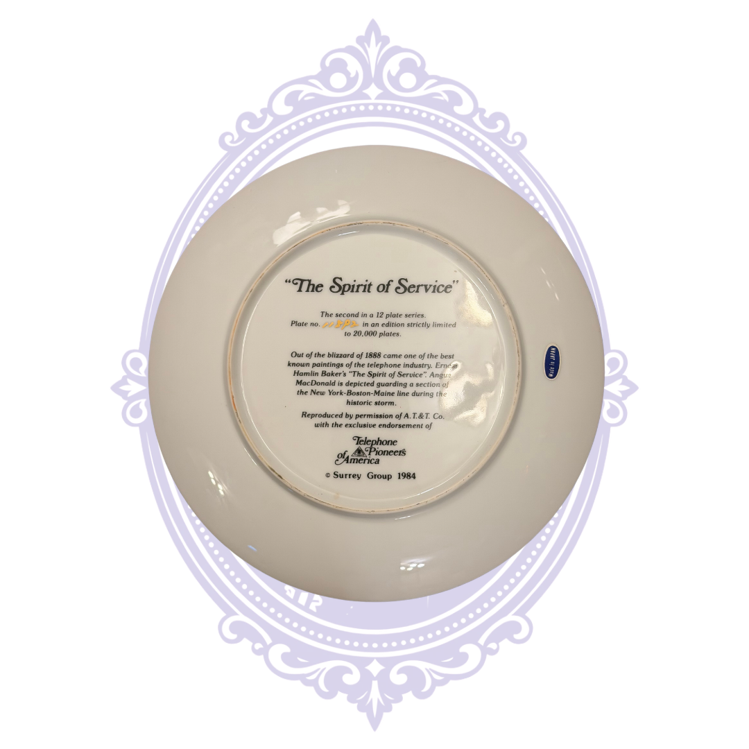 Reverse of 1984 The Spirit of Service Telephone Pioneers of America collector plate, second in a 12-plate series, with Blizzard of 1888 historical inscription, handwritten edition number, Surrey Group mark and Made in Japan sticker