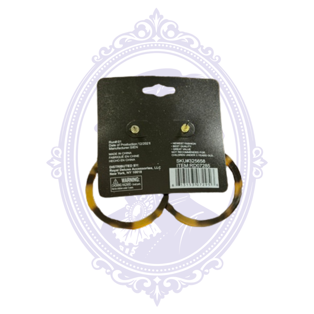 Back of original retail card for tortoiseshell-look hoop earrings showing item information, barcode and Made in China marking.