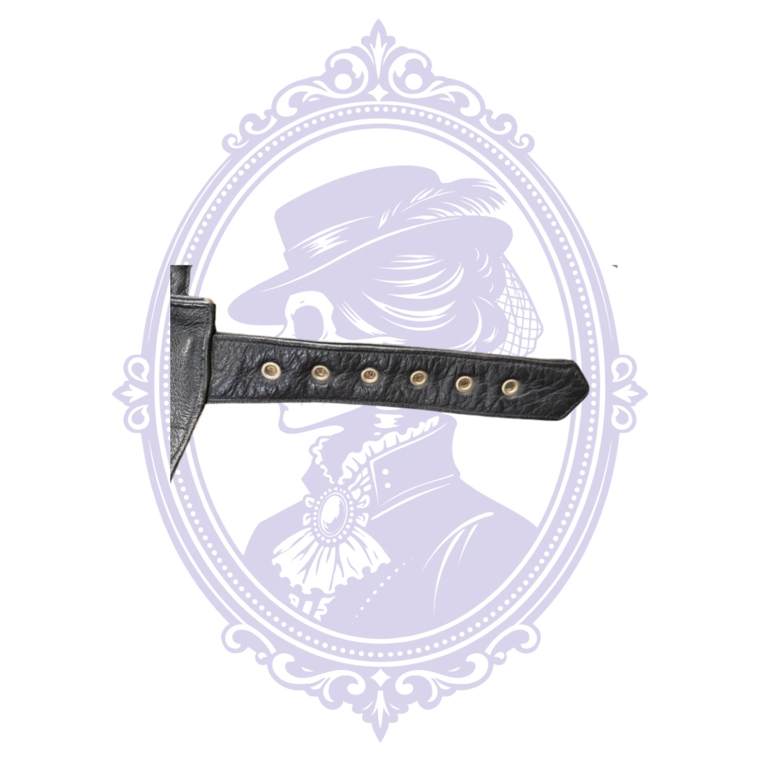 Adjustable black leather belt with six metal eyelets on UNIK motorcycle chaps