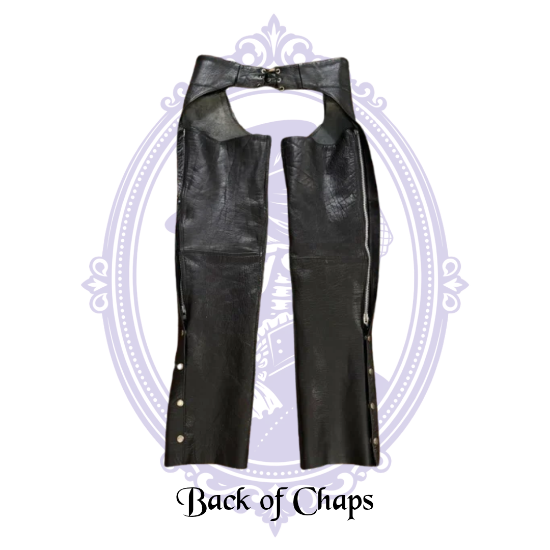 Back view of UNIK International black leather motorcycle chaps showing long leg zippers and metal snaps