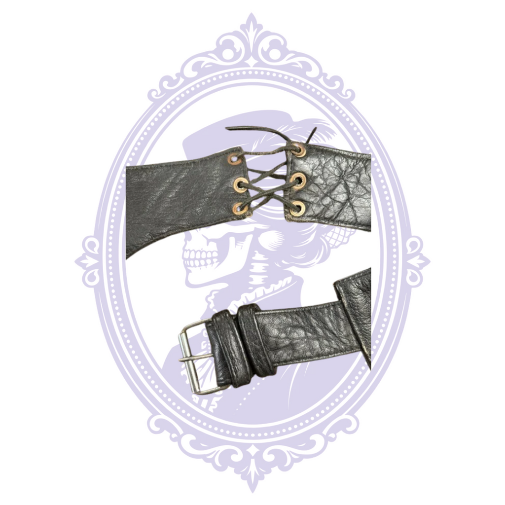 Close-up of adjustable leather waist buckle and lace-up rear section of UNIK motorcycle chaps