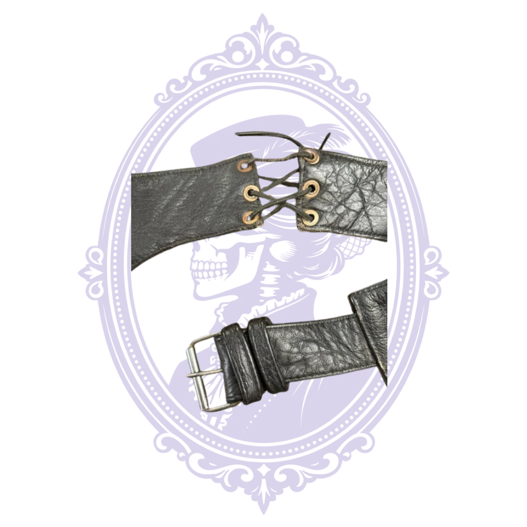 Close-up of adjustable leather waist buckle and lace-up rear section of UNIK motorcycle chaps