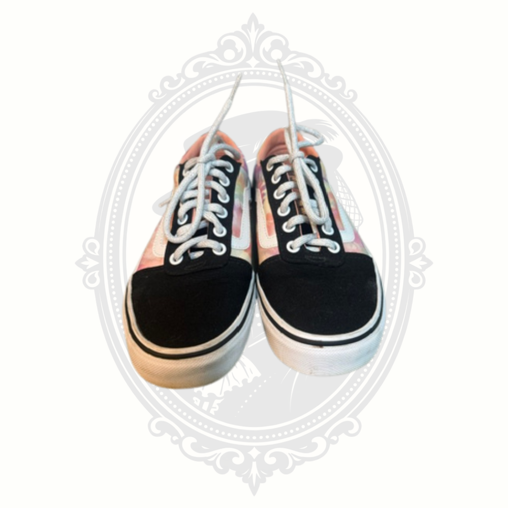 Front-facing view of VANS sneakers showing toe shape and lace condition.