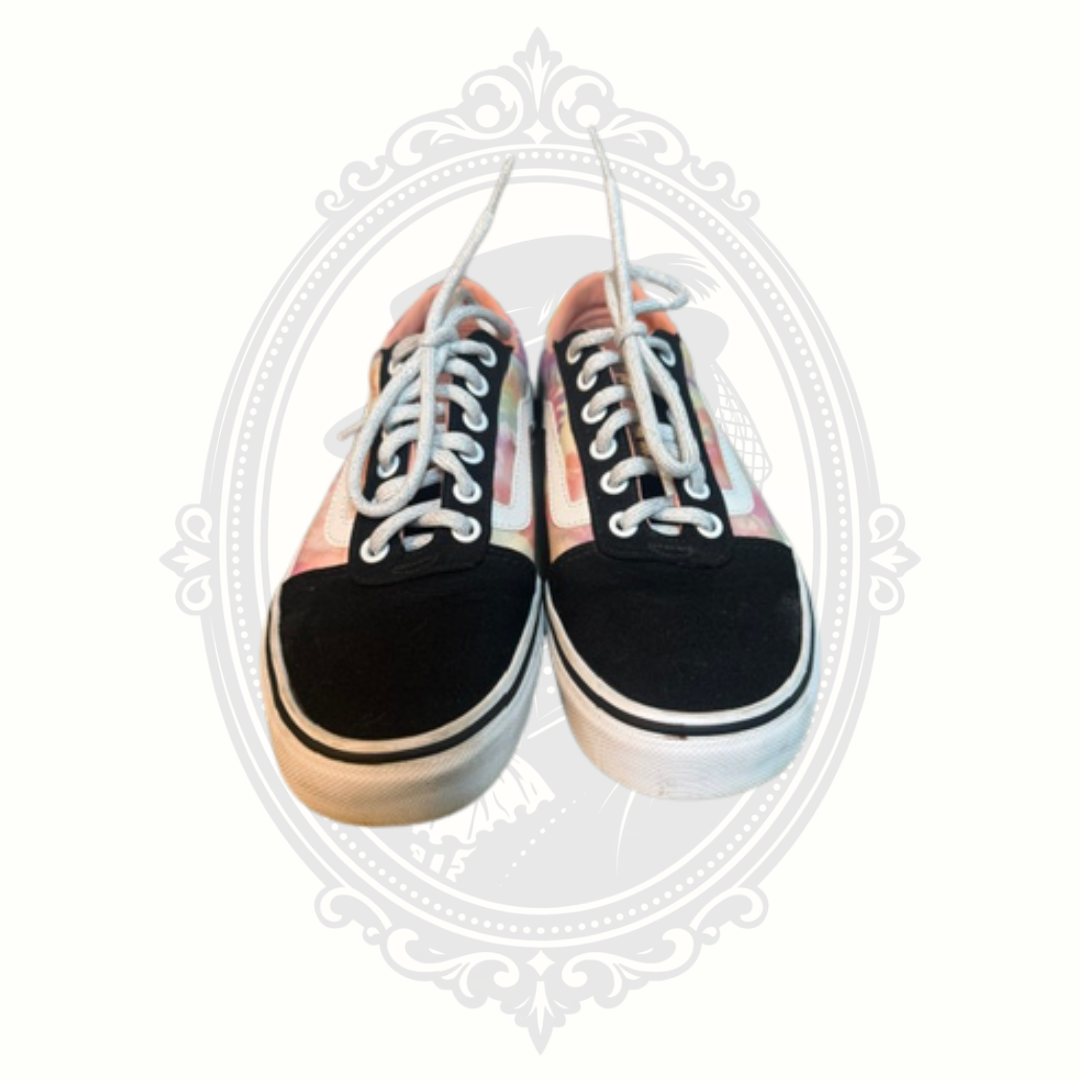 Front-facing view of VANS sneakers showing toe shape and lace condition.