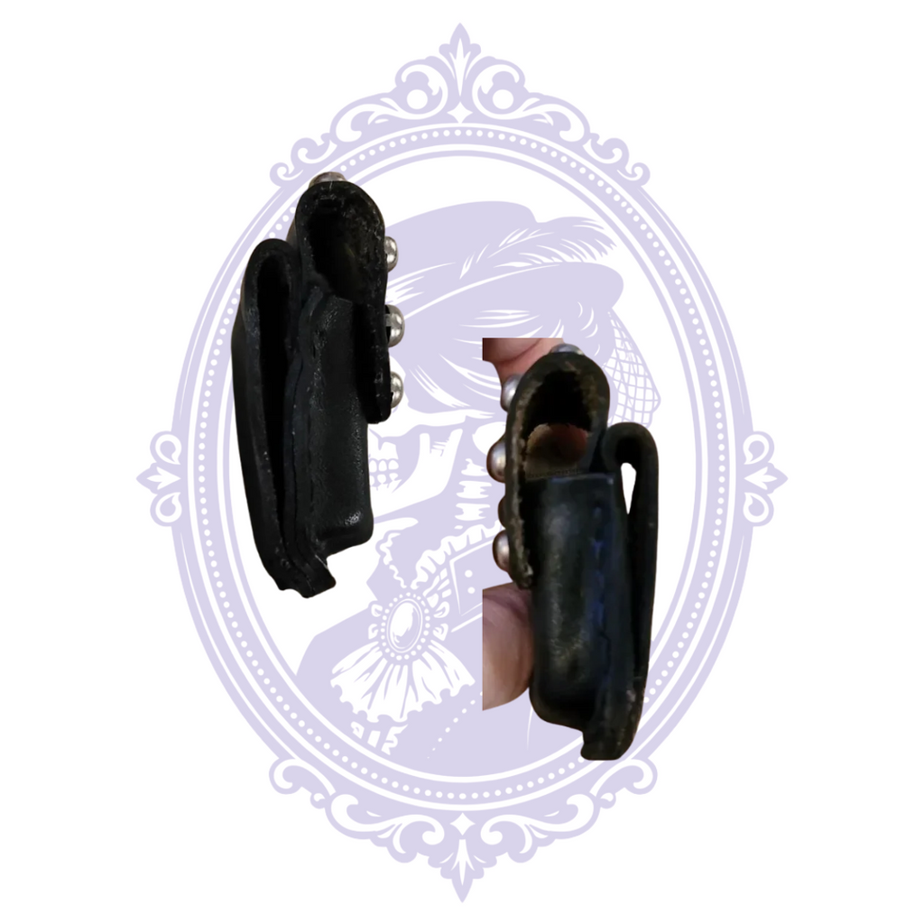 Side profiles of black leather pouch with belt loop