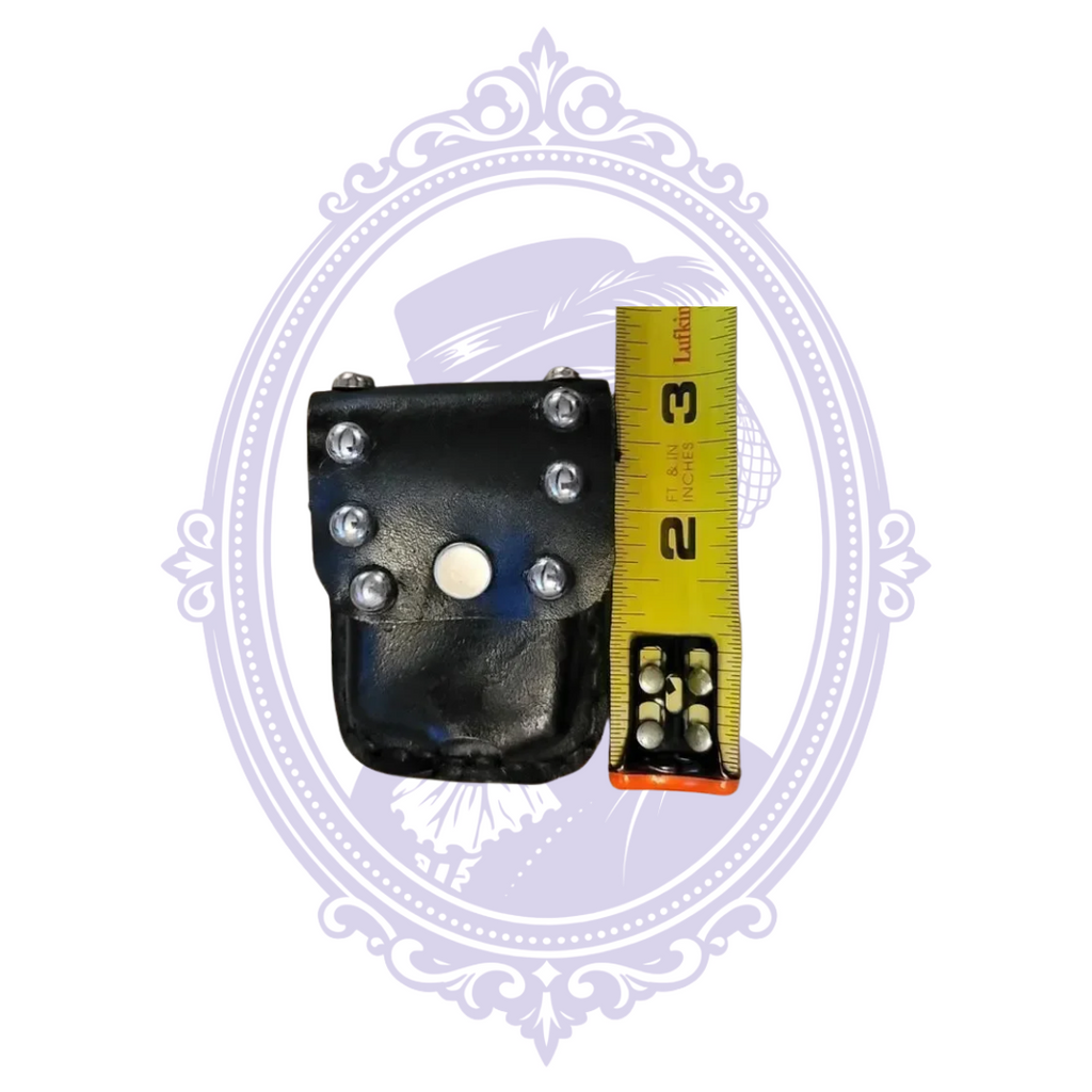Pouch beside tape measure showing height
