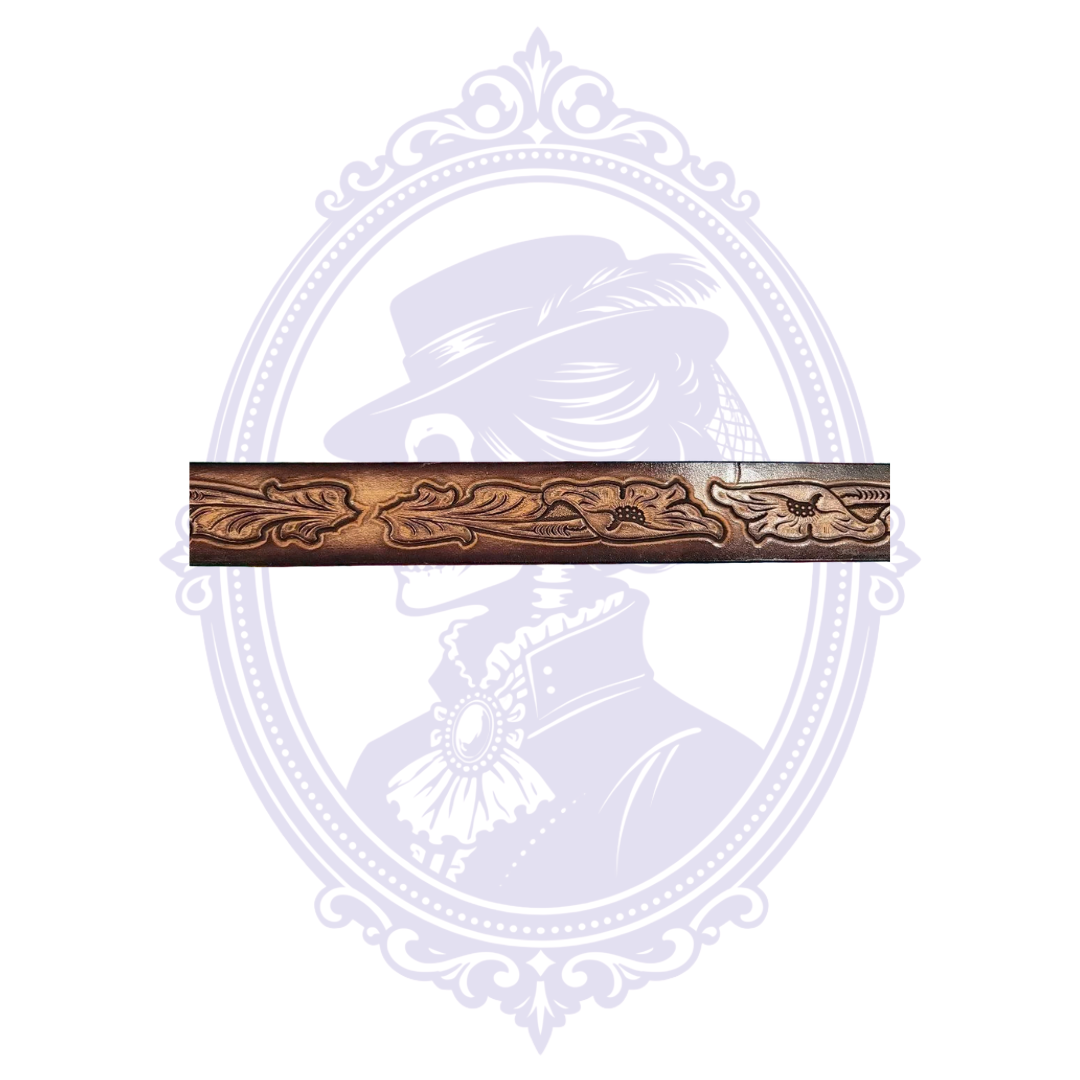 Flat close-up of vintage brown leather belt showing repeated carved flowers and flowing leaf designs across its length.