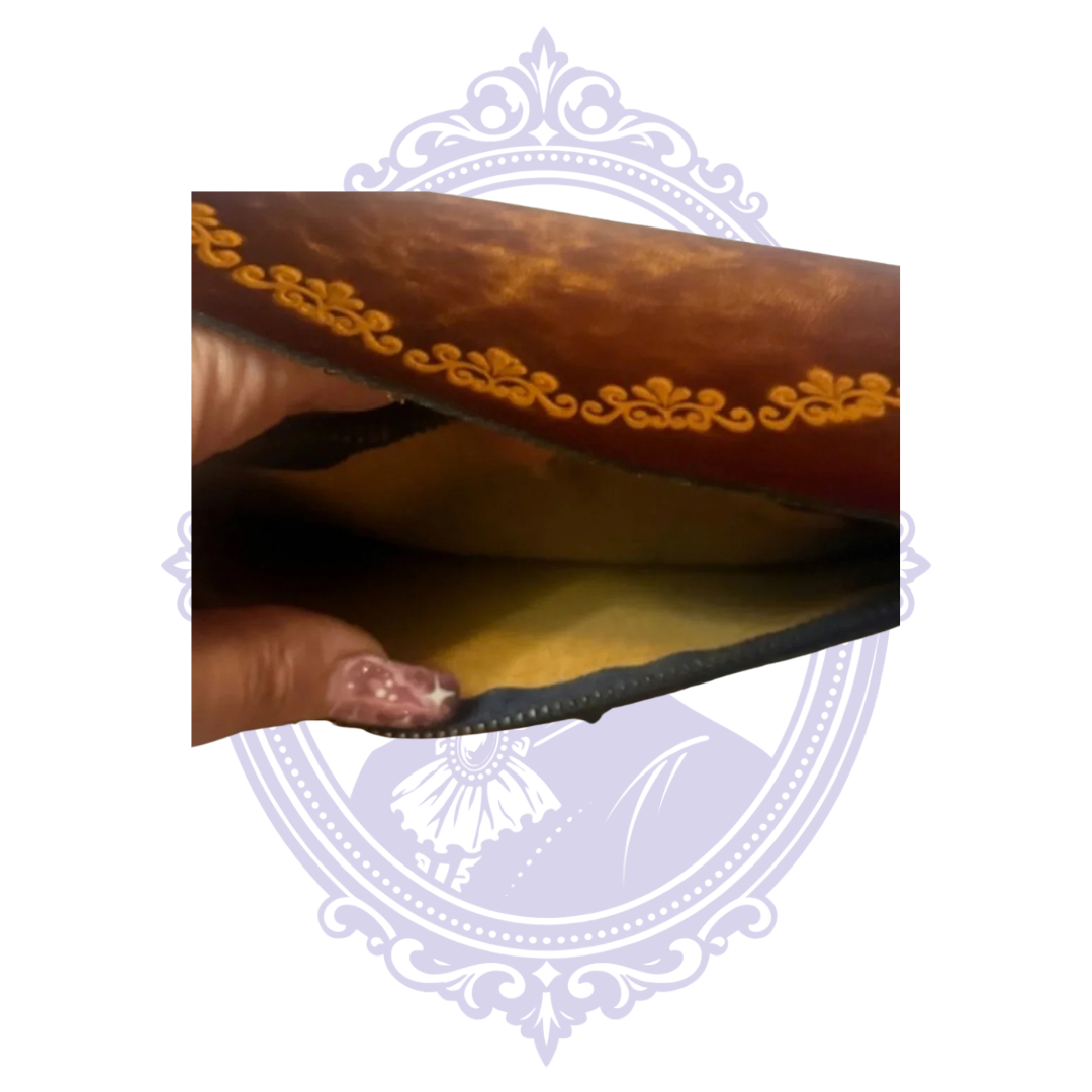 Close-up of an open interior slip compartment in vintage brown leather chain wallet BBL-13, showing leather lining and floral tooling on flap.
