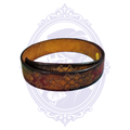 Vintage brown genuine leather belt size 48, coiled to show embossed geometric tooling and red decorative accents.