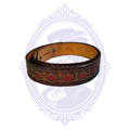 Coiled brown genuine leather belt with repeating red floral medallions, diamond motifs, decorative tooled borders and tan leather reverse.
