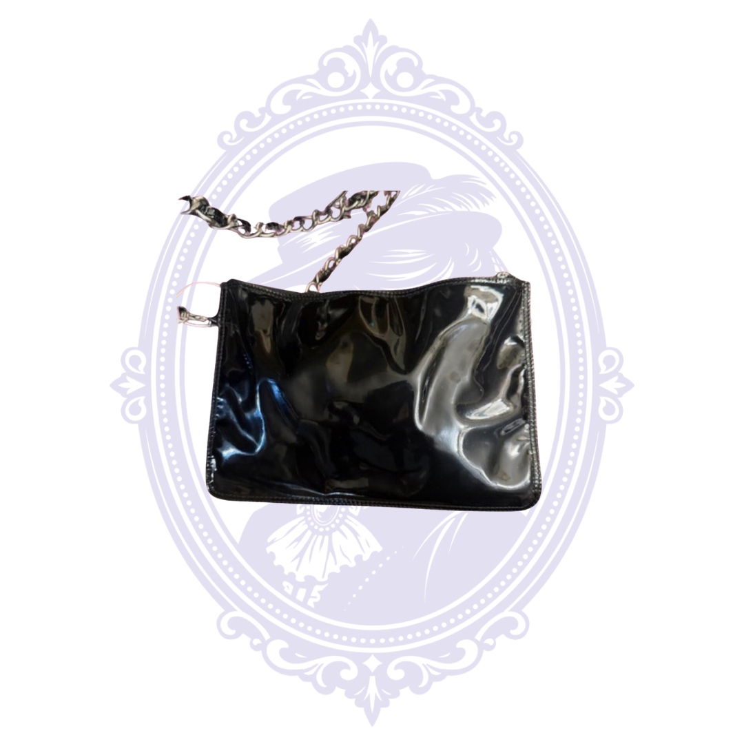 Matching black patent leather zippered pouch with chain attachment from vintage Chanel Triple Coco tote.