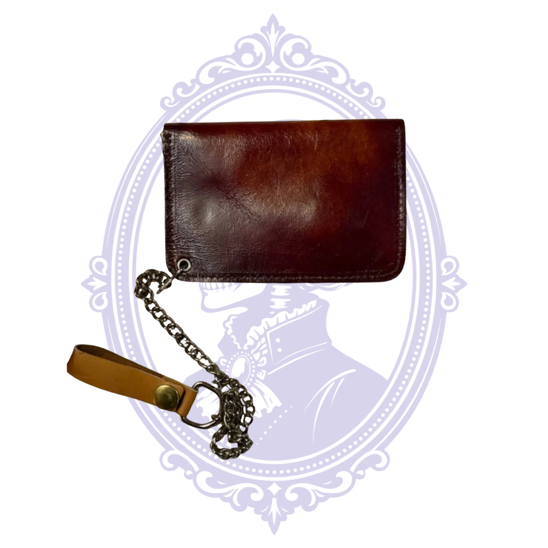 Back view of vintage chestnut brown leather longhorn trucker wallet BBL-07 showing plain leather reverse, chain attachment and tan leather belt-loop strap.