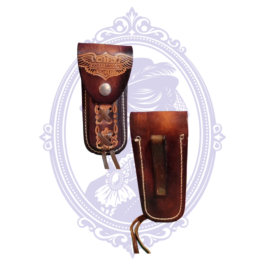 Side-by-side front and back of vintage brown leather knife sheath with Harley-Davidson winged Bar and Shield design.