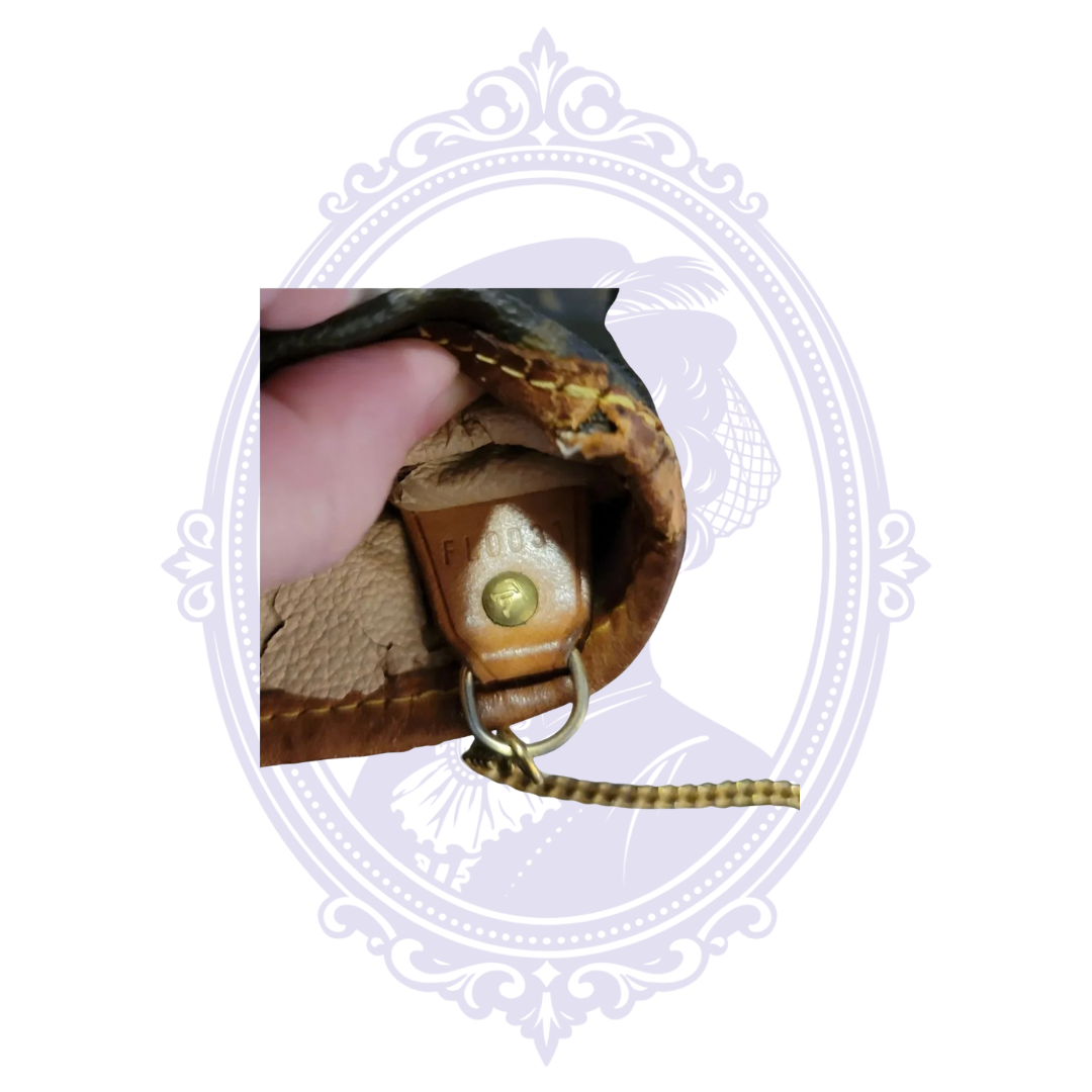 Louis Vuitton date code FL0031 inside vintage Petit Bucket PM, indicating France production in March 2001.