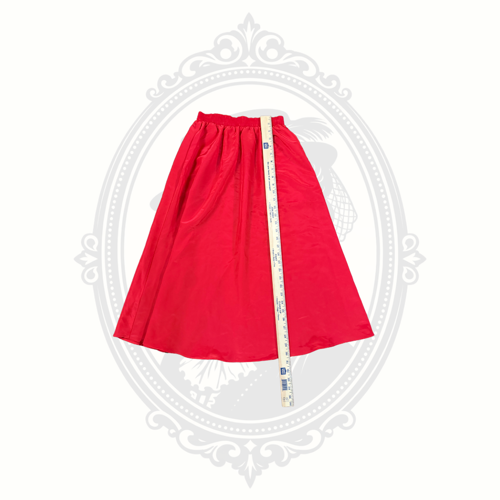Red A-line skirt with ruler showing full length measurement