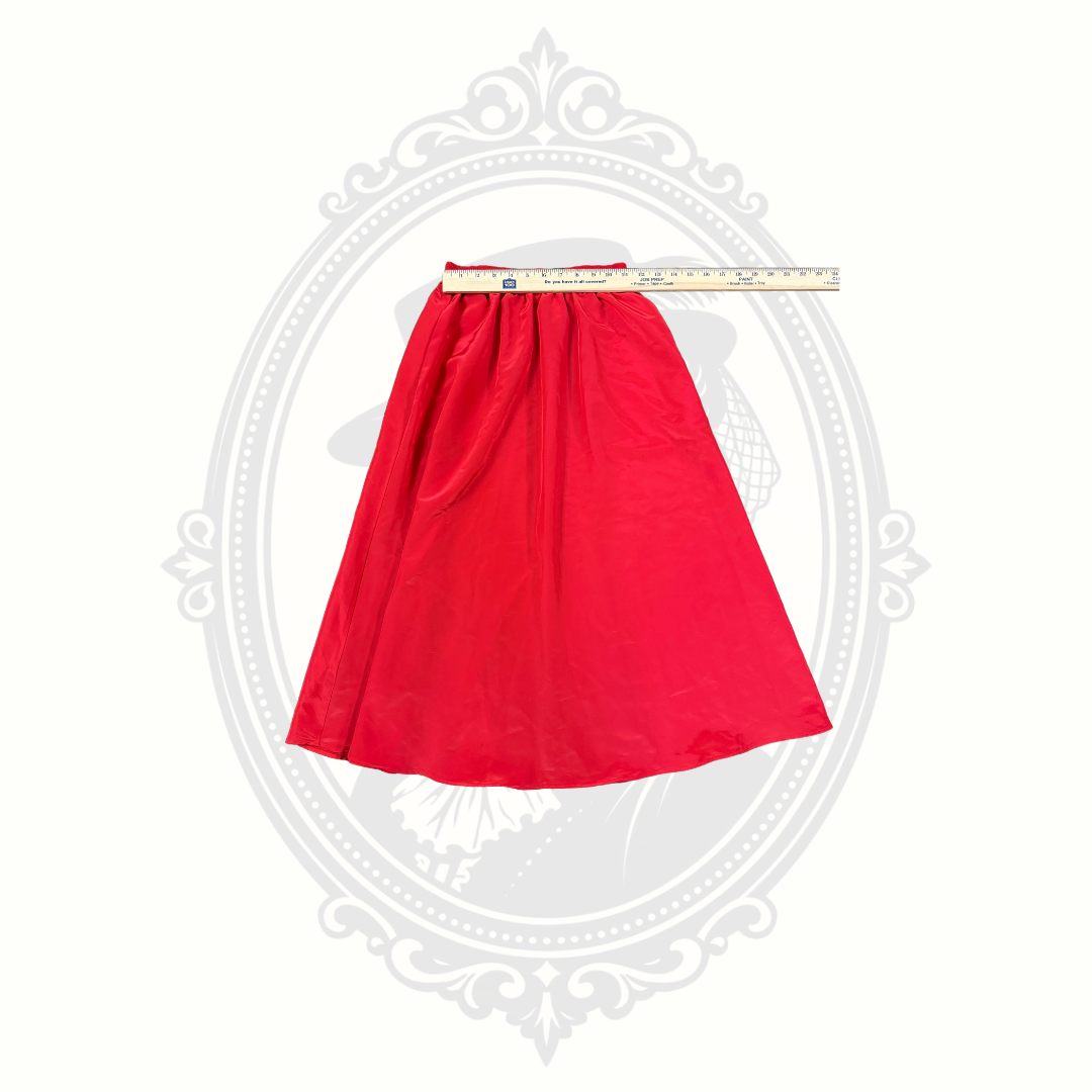 Red skirt elastic waistband with ruler showing waist measurement