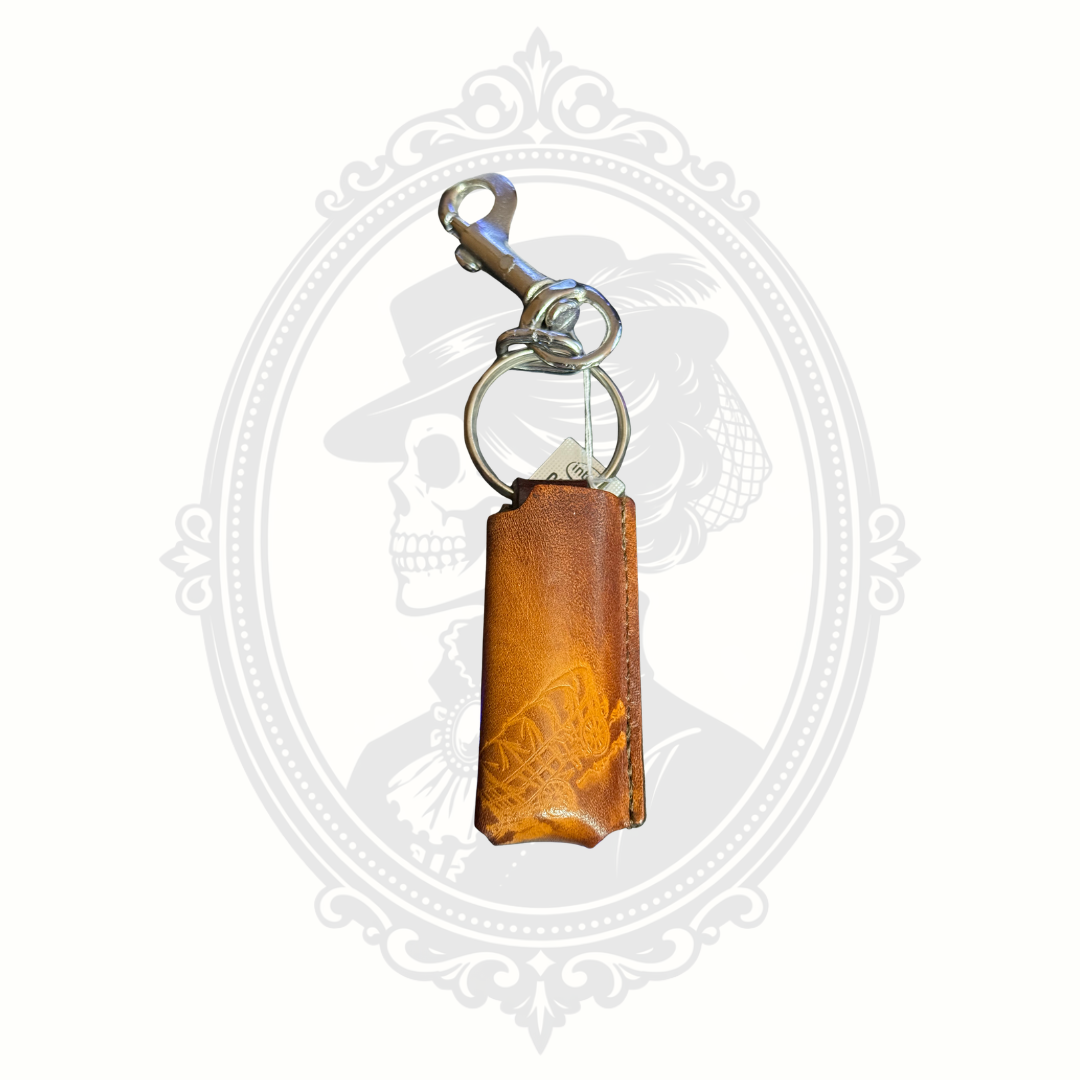 Vintage leather lighter holder with tooled Conestoga wagon design and metal clip keychain