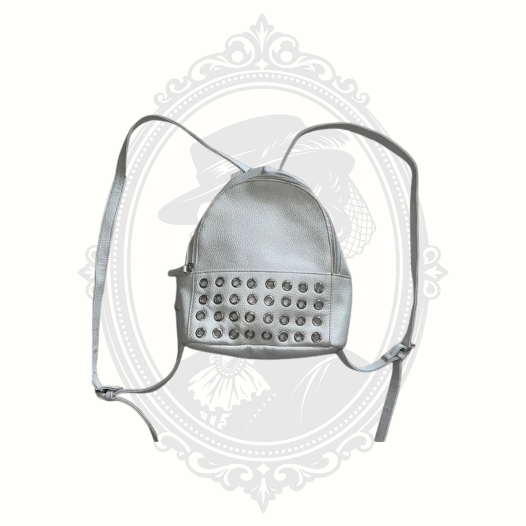White mini backpack with extended straps showing full length and crossbody styling option