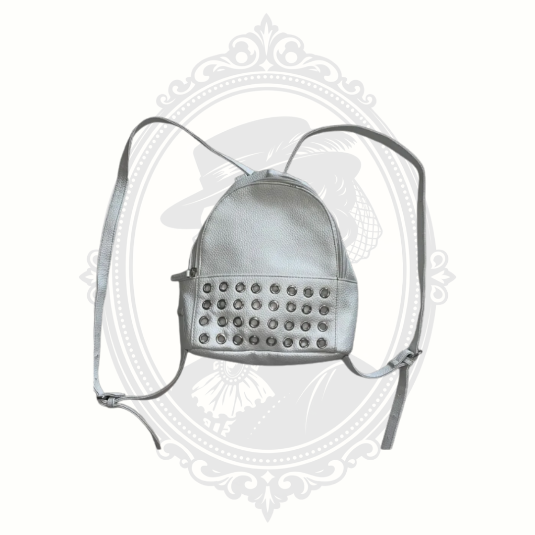 White mini backpack with extended straps showing full length and crossbody styling option
