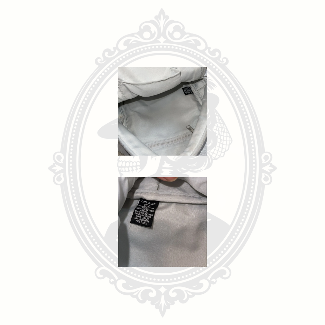 Interior of white mini backpack showing clean lining and storage space