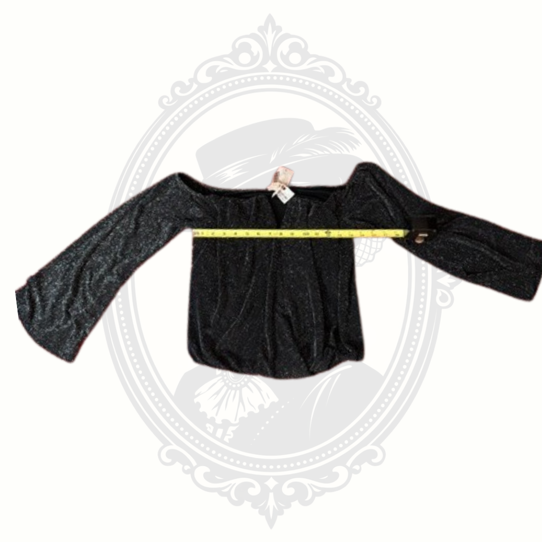 Black long-sleeve top with a measuring tape on a white background